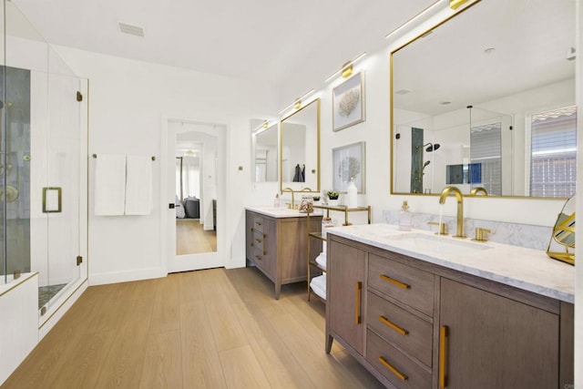 10576 Pinion Trl, Escondido, CA 92026 - full bath with wood finished floors, a shower stall, and two vanities
