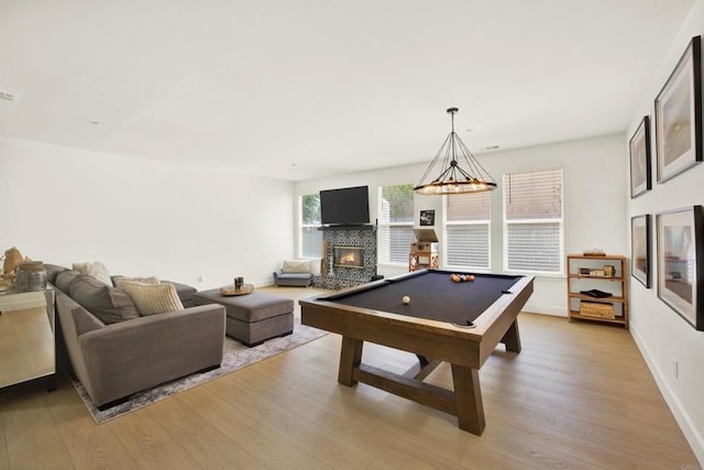 10576 Pinion Trl, Escondido, CA 92026 - game room featuring light wood-type flooring, billiards table, a chandelier, and a glass covered fireplace
