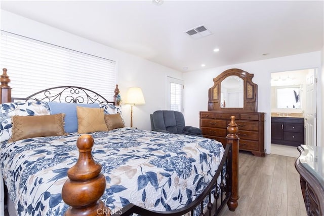 6843 Penfield Ave, Winnetka, CA 91306 - bedroom featuring light wood finished floors, ensuite bath, and recessed lighting