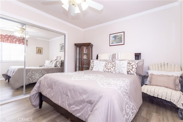 6843 Penfield Ave, Winnetka, CA 91306 - bedroom with wood finished floors, a closet, ornamental molding, and a ceiling fan