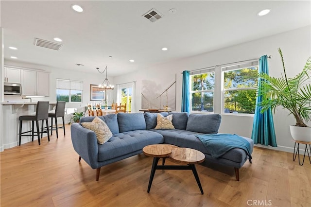 28238 Alton Way, Castaic, CA 91384 - living area featuring recessed lighting, light wood finished floors, and a chandelier