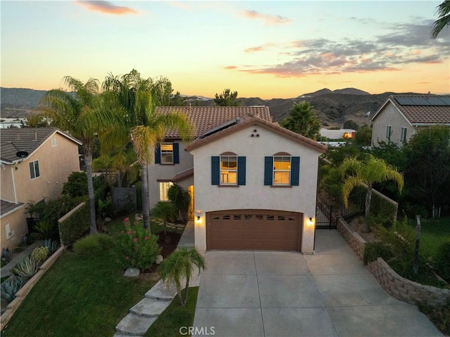 28238 Alton Way, Castaic, CA 91384 - mediterranean / spanish home featuring an attached garage, stucco siding, concrete driveway, a tile roof, and a mountain view