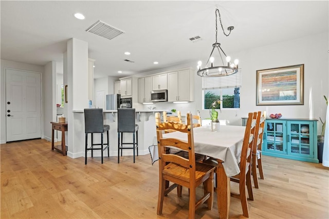 28238 Alton Way, Castaic, CA 91384 - dining room with light wood-type flooring, a chandelier, and recessed lighting