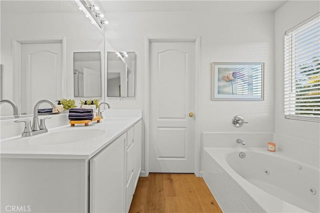 28238 Alton Way, Castaic, CA 91384 - bathroom featuring double vanity, a tub with jets, and wood finished floors