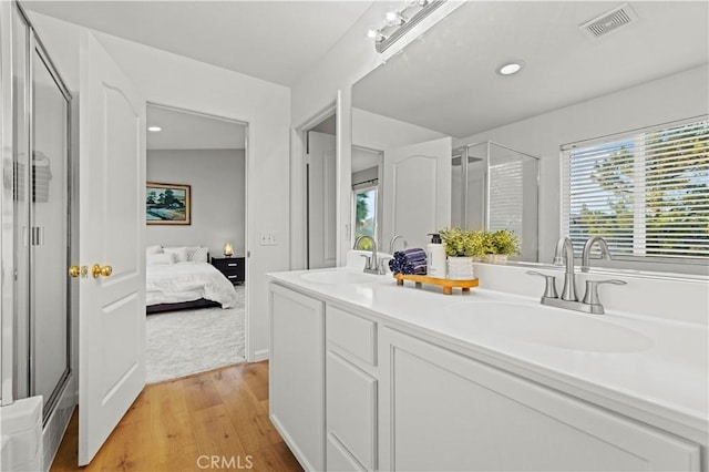 28238 Alton Way, Castaic, CA 91384 - bathroom with a stall shower, wood finished floors, ensuite bathroom, double vanity, and recessed lighting