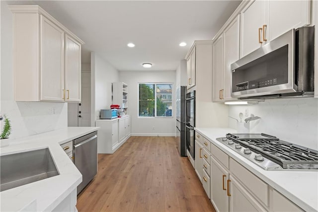 28238 Alton Way, Castaic, CA 91384 - kitchen featuring stainless steel appliances, recessed lighting, light wood finished floors, light countertops, and white cabinets