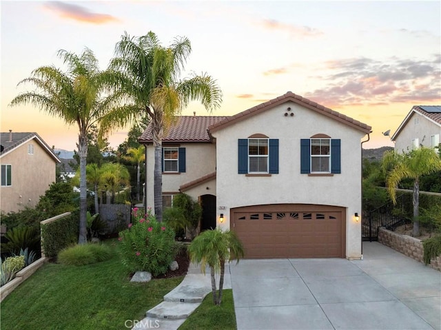 28238 Alton Way, Castaic, CA 91384 - mediterranean / spanish-style home with concrete driveway, an attached garage, stucco siding, and a tiled roof