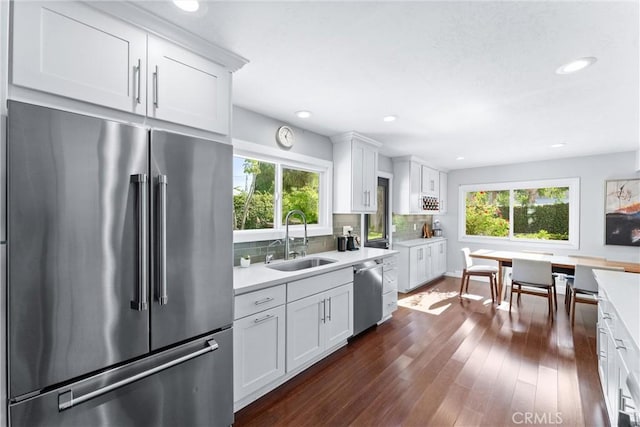 1780 N Mockingbird Pl, Orange, CA 92867 - kitchen featuring stainless steel appliances, light countertops, decorative backsplash, white cabinetry, and recessed lighting