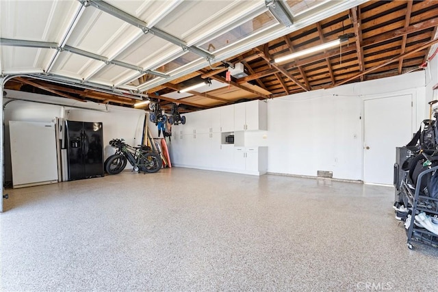 1780 N Mockingbird Pl, Orange, CA 92867 - garage featuring black fridge and a garage door opener