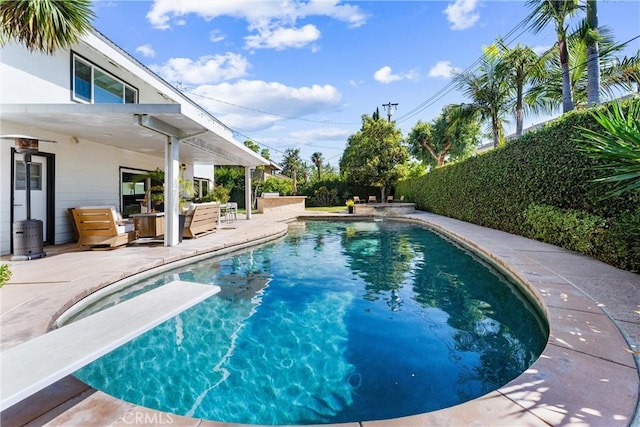 1780 N Mockingbird Pl, Orange, CA 92867 - view of swimming pool featuring a diving board, a patio, and a fenced backyard