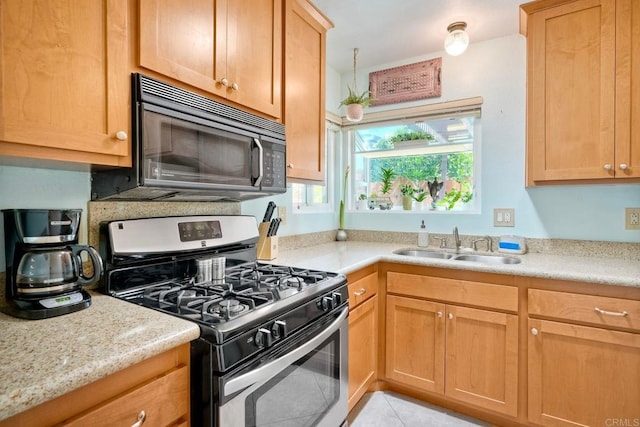 826 Laurelwood Ct, San Marcos, CA 92069 - kitchen featuring stainless steel gas stove, black microwave, and light tile patterned floors