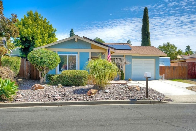 826 Laurelwood Ct, San Marcos, CA 92069 - ranch-style home with stucco siding, a garage, solar panels, and driveway