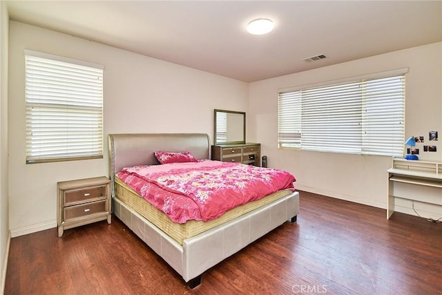 13288 Cactus Flower St, Eastvale, CA 92880 - bedroom with dark wood finished floors and baseboards