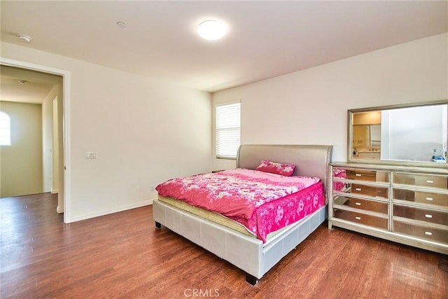 13288 Cactus Flower St, Eastvale, CA 92880 - bedroom featuring wood finished floors and multiple windows
