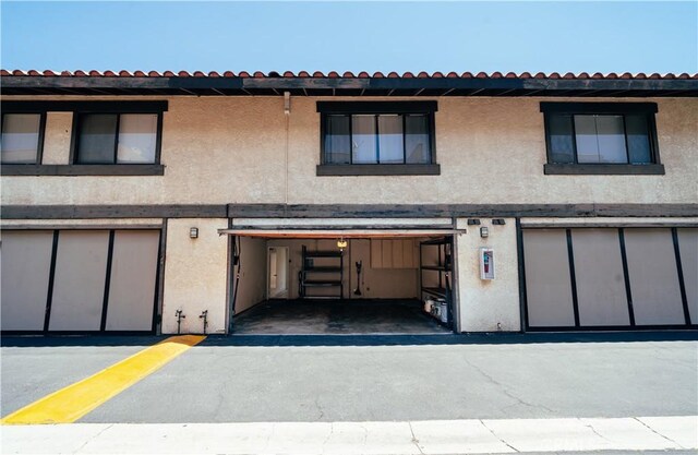 1438 W 146th St Unit 6, Gardena, CA 90247 - back of property featuring stucco siding and an attached garage