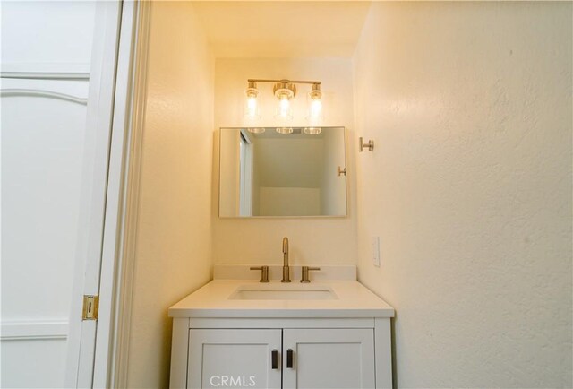 1438 W 146th St Unit 6, Gardena, CA 90247 - bathroom with vanity and a textured wall