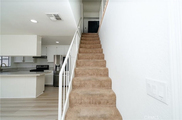 1438 W 146th St Unit 6, Gardena, CA 90247 - stairway with wood finished floors and recessed lighting