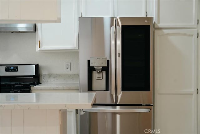 1438 W 146th St Unit 6, Gardena, CA 90247 - kitchen featuring stainless steel appliances, wall chimney exhaust hood, light countertops, and white cabinets