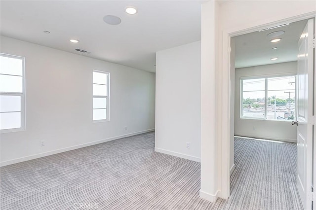 14180 Bay St, La Mirada, CA 90638 - empty room with light colored carpet and recessed lighting