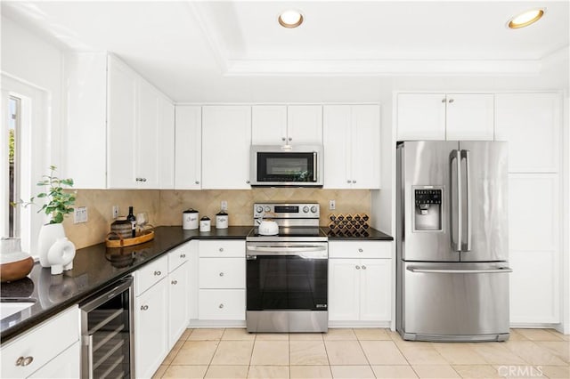 18701 Paseo Cortez, Irvine, CA 92603 - kitchen featuring appliances with stainless steel finishes, beverage cooler, tasteful backsplash, recessed lighting, and white cabinets