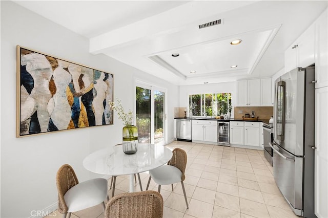 18701 Paseo Cortez, Irvine, CA 92603 - kitchen featuring stainless steel appliances, beverage cooler, dark countertops, white cabinetry, and recessed lighting