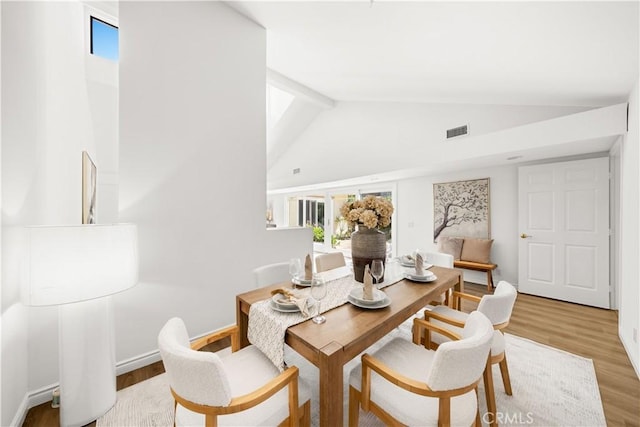 18701 Paseo Cortez, Irvine, CA 92603 - dining area with light wood-style flooring, high vaulted ceiling, and beam ceiling
