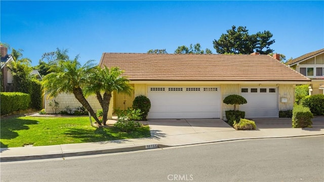 18701 Paseo Cortez, Irvine, CA 92603 - view of front of property with a garage, driveway, a front yard, and a tile roof