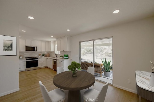 27825 Beryl Rd, Barstow, CA 92311 - dining area featuring recessed lighting and light wood finished floors