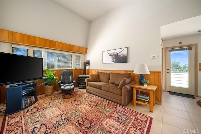 1505 Tiffany Ranch Rd, Arroyo Grande, CA 93420 - living room featuring high vaulted ceiling, wainscoting, light tile patterned flooring, and wooden walls