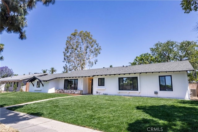 20611 Devonshire St, Chatsworth, CA 91311 - ranch-style house featuring a front lawn and roof with shingles