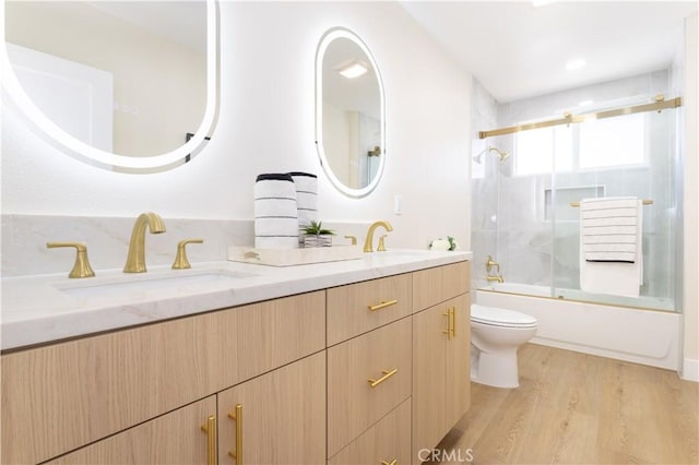 20611 Devonshire St, Chatsworth, CA 91311 - bathroom with double vanity, combined bath / shower with glass door, and wood finished floors