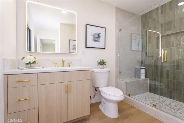 20611 Devonshire St, Chatsworth, CA 91311 - bathroom featuring vanity, wood finished floors, and a stall shower