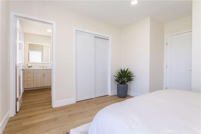 20611 Devonshire St, Chatsworth, CA 91311 - bedroom featuring light wood finished floors, recessed lighting, and a closet