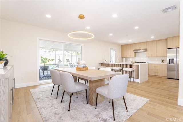 20611 Devonshire St, Chatsworth, CA 91311 - dining room with light wood finished floors and recessed lighting