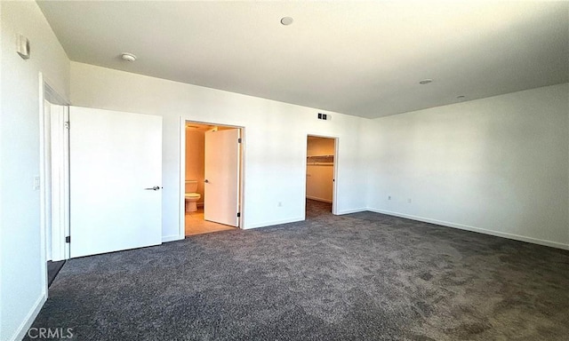 612 E Carson St Unit 303, Carson, CA 90745 - unfurnished bedroom with carpet flooring, a spacious closet, ensuite bathroom, and a closet
