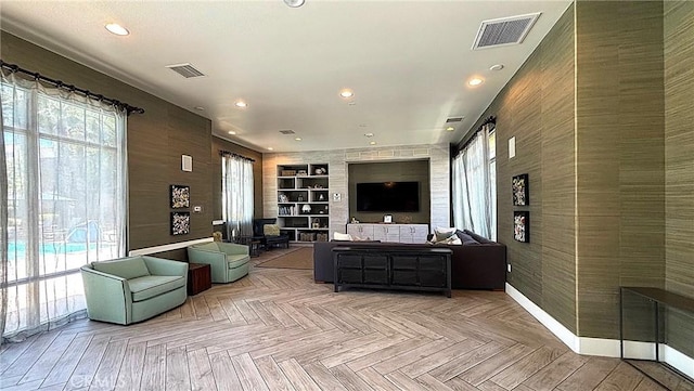 612 E Carson St Unit 303, Carson, CA 90745 - living area featuring an accent wall, recessed lighting, and built in features