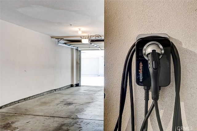 5410 W 149th Pl Unit 12, Hawthorne, CA 90250 - garage with a garage door opener and electric vehicle charger
