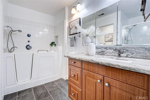 5410 W 149th Pl Unit 12, Hawthorne, CA 90250 - bathroom featuring a shower, vanity, a tub, and tile patterned flooring
