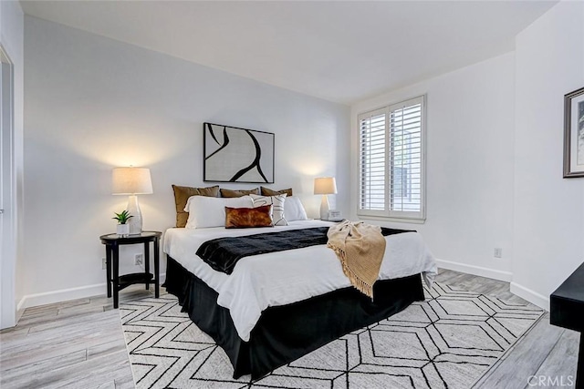 5410 W 149th Pl Unit 12, Hawthorne, CA 90250 - bedroom featuring light wood finished floors and baseboards
