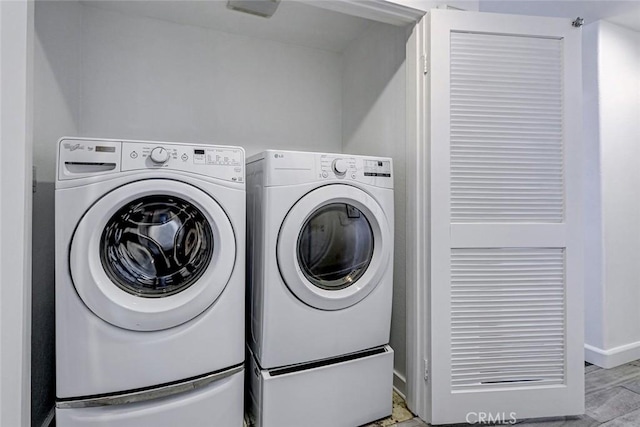 5410 W 149th Pl Unit 12, Hawthorne, CA 90250 - washroom with washer and dryer and light wood finished floors