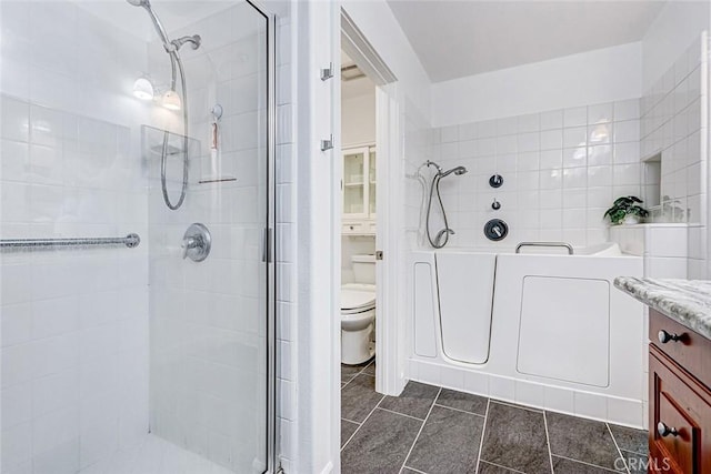 5410 W 149th Pl Unit 12, Hawthorne, CA 90250 - full bath featuring a shower stall, a garden tub, tile patterned floors, and vanity