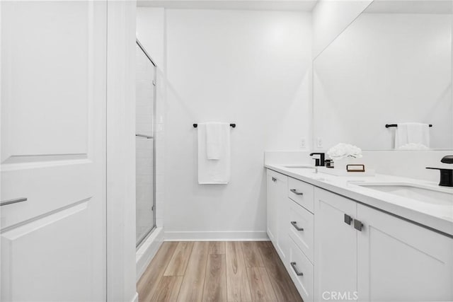 10 Wisteria St, Rancho Mission Viejo, CA 92694 - full bath featuring a shower stall, double vanity, and wood finished floors