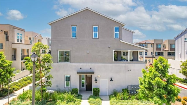 10 Wisteria St, Rancho Mission Viejo, CA 92694 - back of property featuring stucco siding