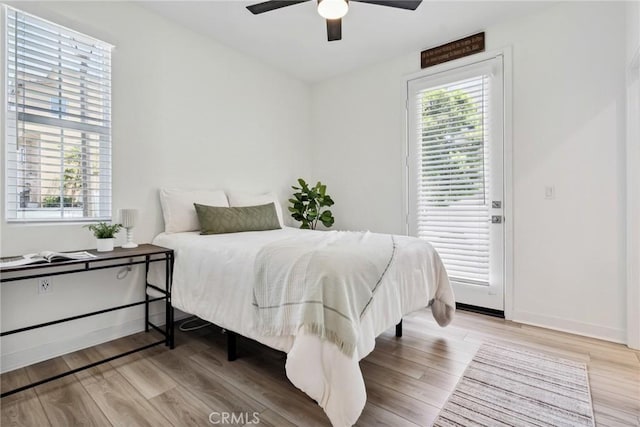 10 Wisteria St, Rancho Mission Viejo, CA 92694 - bedroom with multiple windows, light wood-style floors, and access to exterior