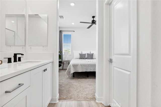10 Wisteria St, Rancho Mission Viejo, CA 92694 - full bath featuring connected bathroom, vanity, wood finished floors, ceiling fan, and recessed lighting