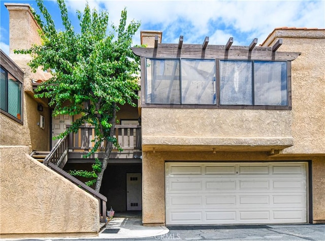 3093 Brea Blvd Unit 16, Fullerton, CA 92835 - view of property with stucco siding and an attached garage