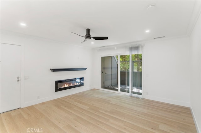 72 Eagle Unit 38, Irvine, CA 92604 - unfurnished living room with light wood-style flooring, ornamental molding, ceiling fan, recessed lighting, and a glass covered fireplace