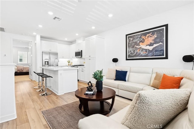 112 Juniper Dr, Rancho Mission Viejo, CA 92694 - living room with light wood-style floors and recessed lighting