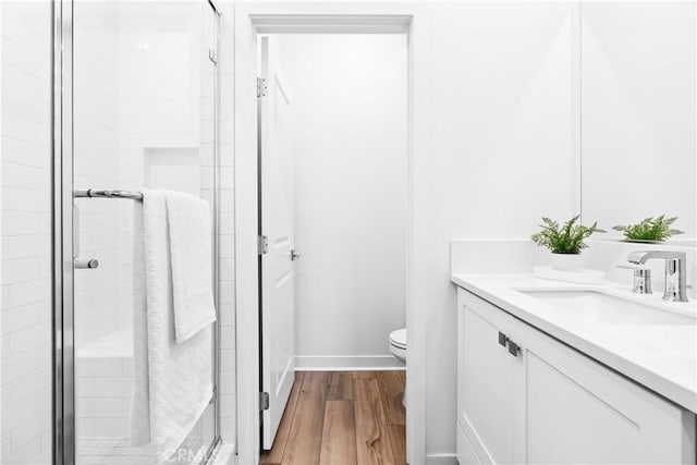 112 Juniper Dr, Rancho Mission Viejo, CA 92694 - full bathroom with vanity, a shower stall, and wood finished floors