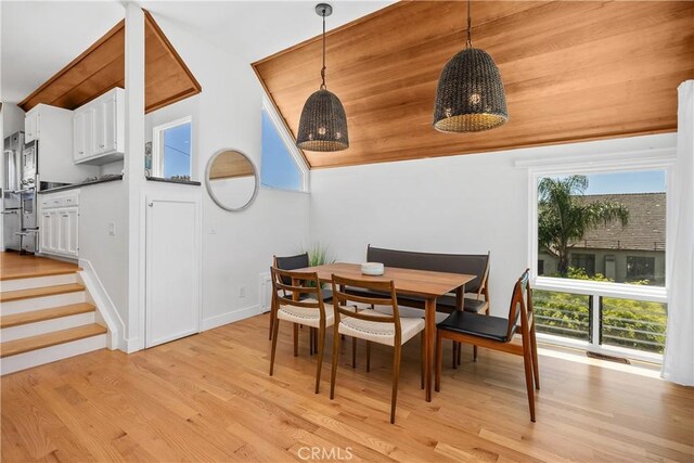 390 Saint Anns Dr, Laguna Beach, CA 92651 - dining room featuring light wood-style floors and lofted ceiling
